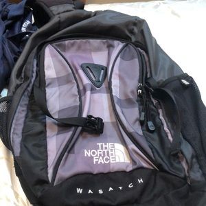Black and grey north face wasatch backpack